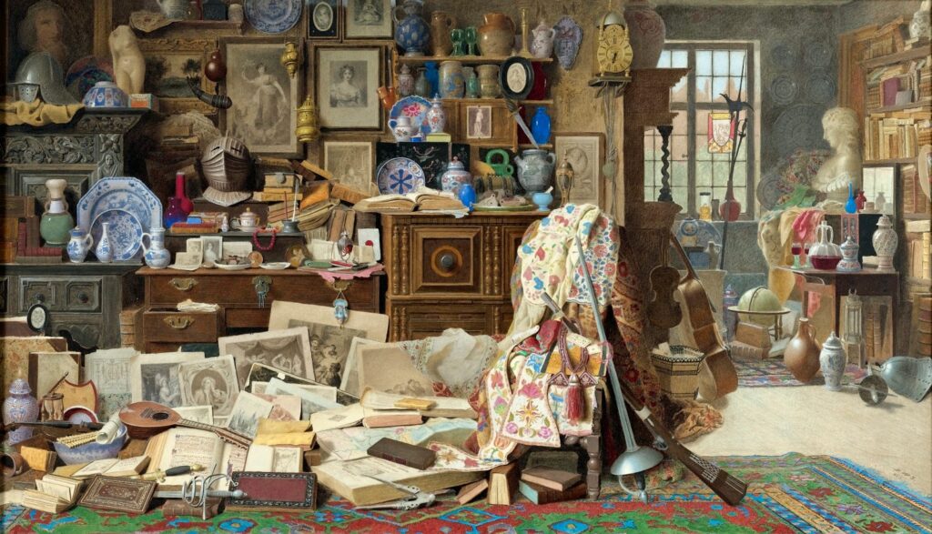 Picture of a cluttered room with books, prints, musical instruments, ceramic containers, and other random objects disorderly covering every bit of surface available.