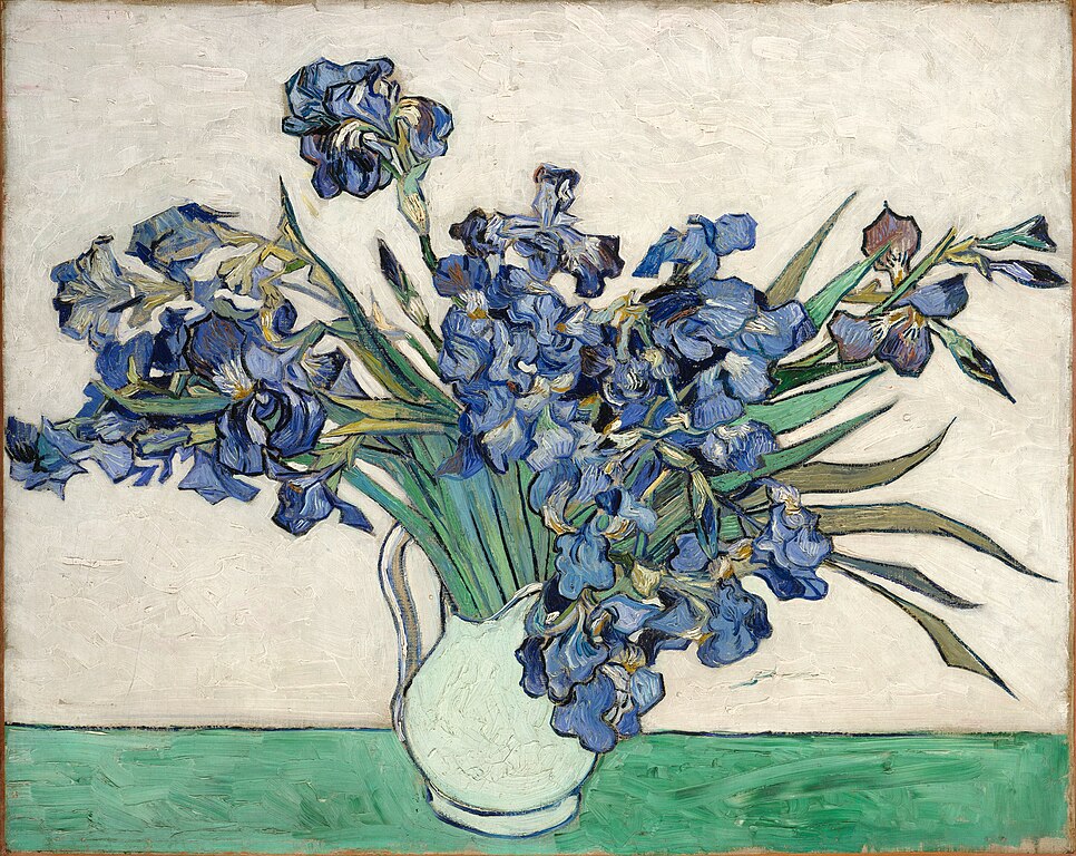 A picture of a vase with irises.