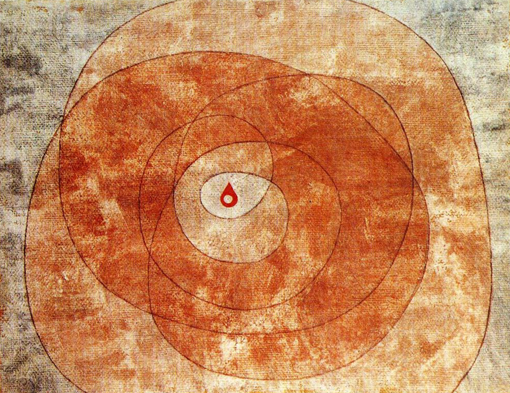 Picture of a red drop at the center of an intricate double spiral pattern painted on a rugged cloth