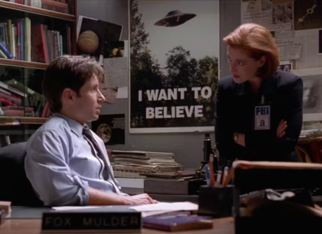 Screenshot from the X-Files episode “Bad Blood” showing Mulder's famous "I Want to Believe" poster