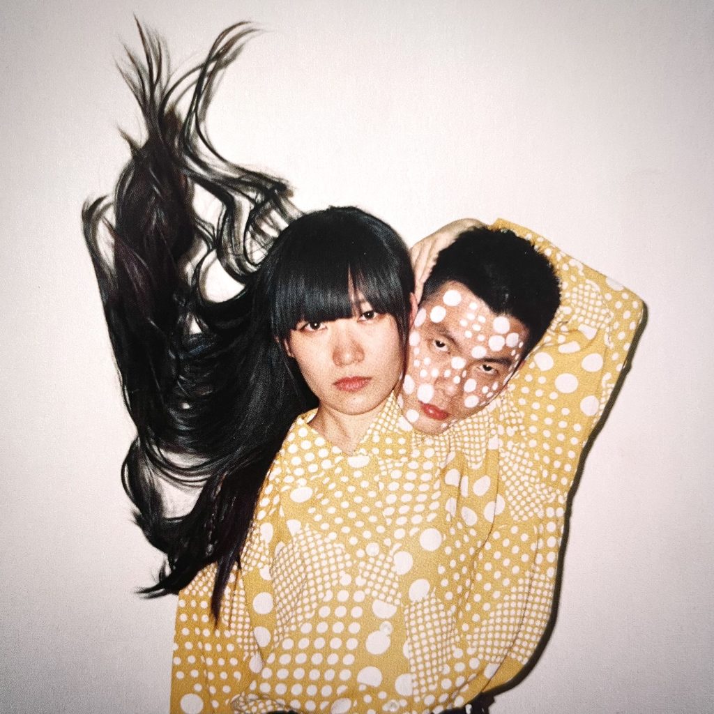 photo of a woman and a man with overlapping geometric patterns